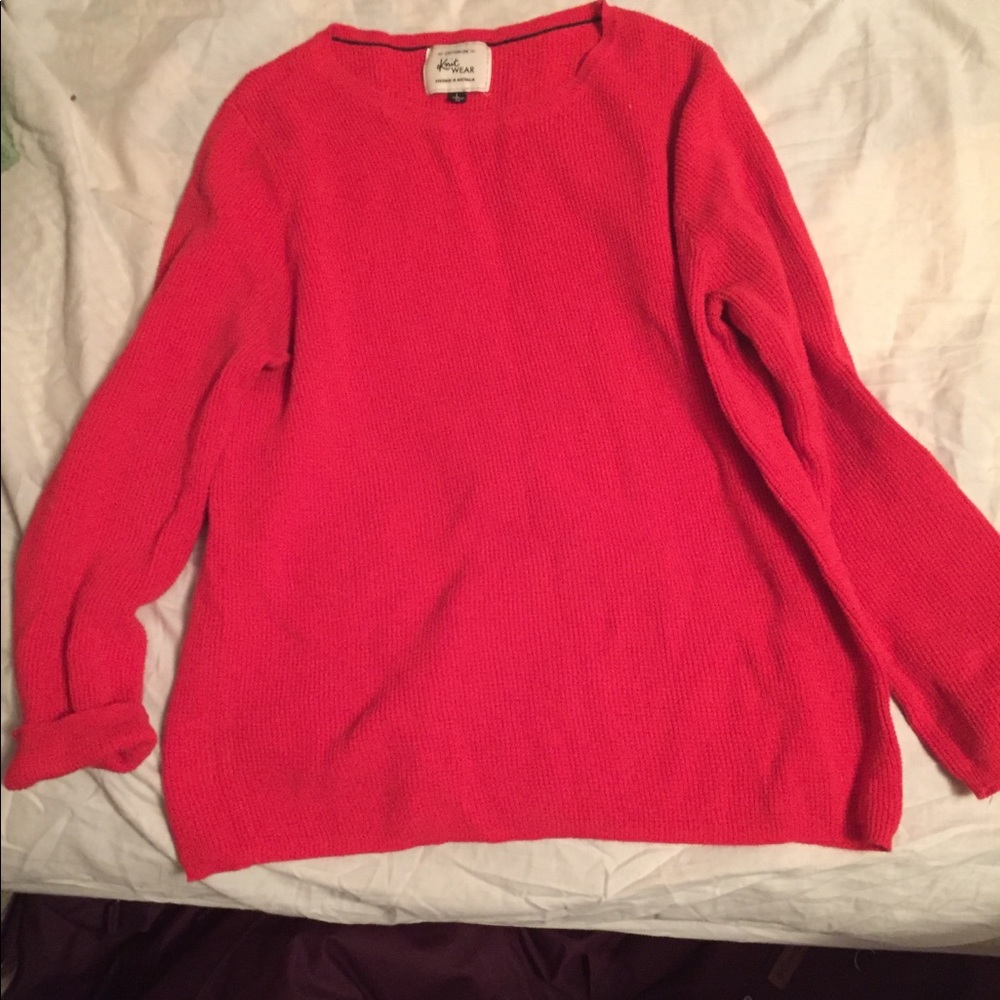 Bright red orange sweater